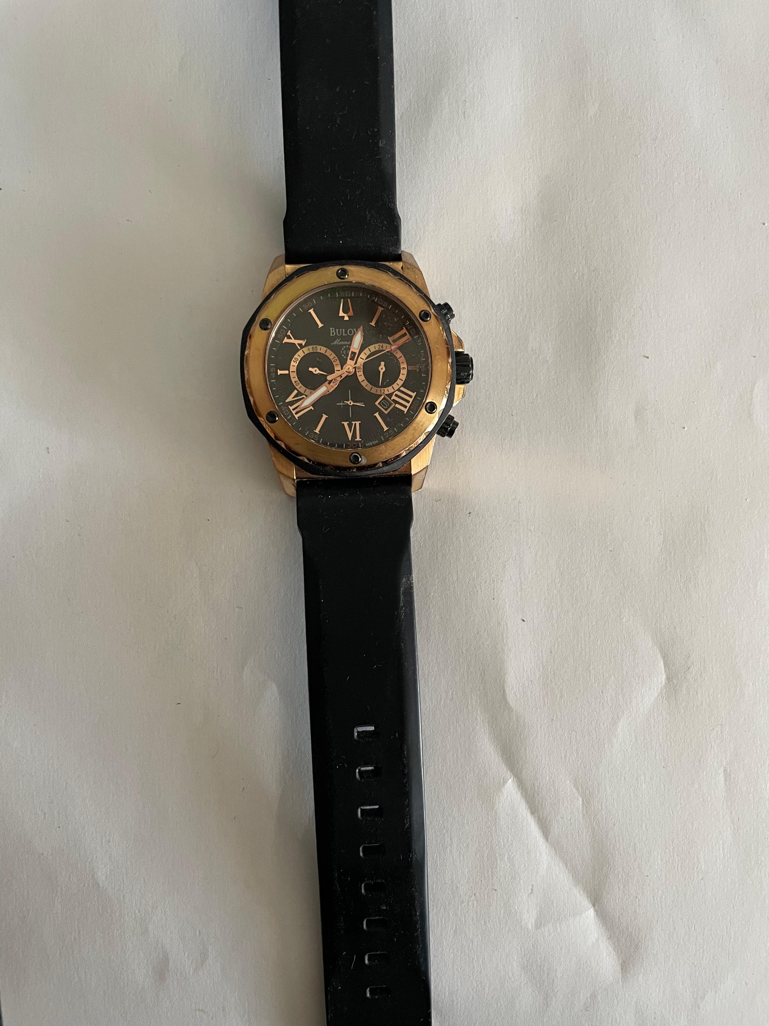 Bulova Gold And Black Chronograph Watch With Roman Markers